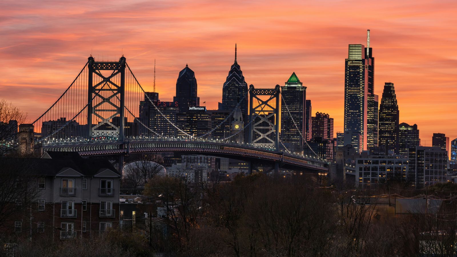 Philadelphia skyline with Ben Franklin Bridge at sunset